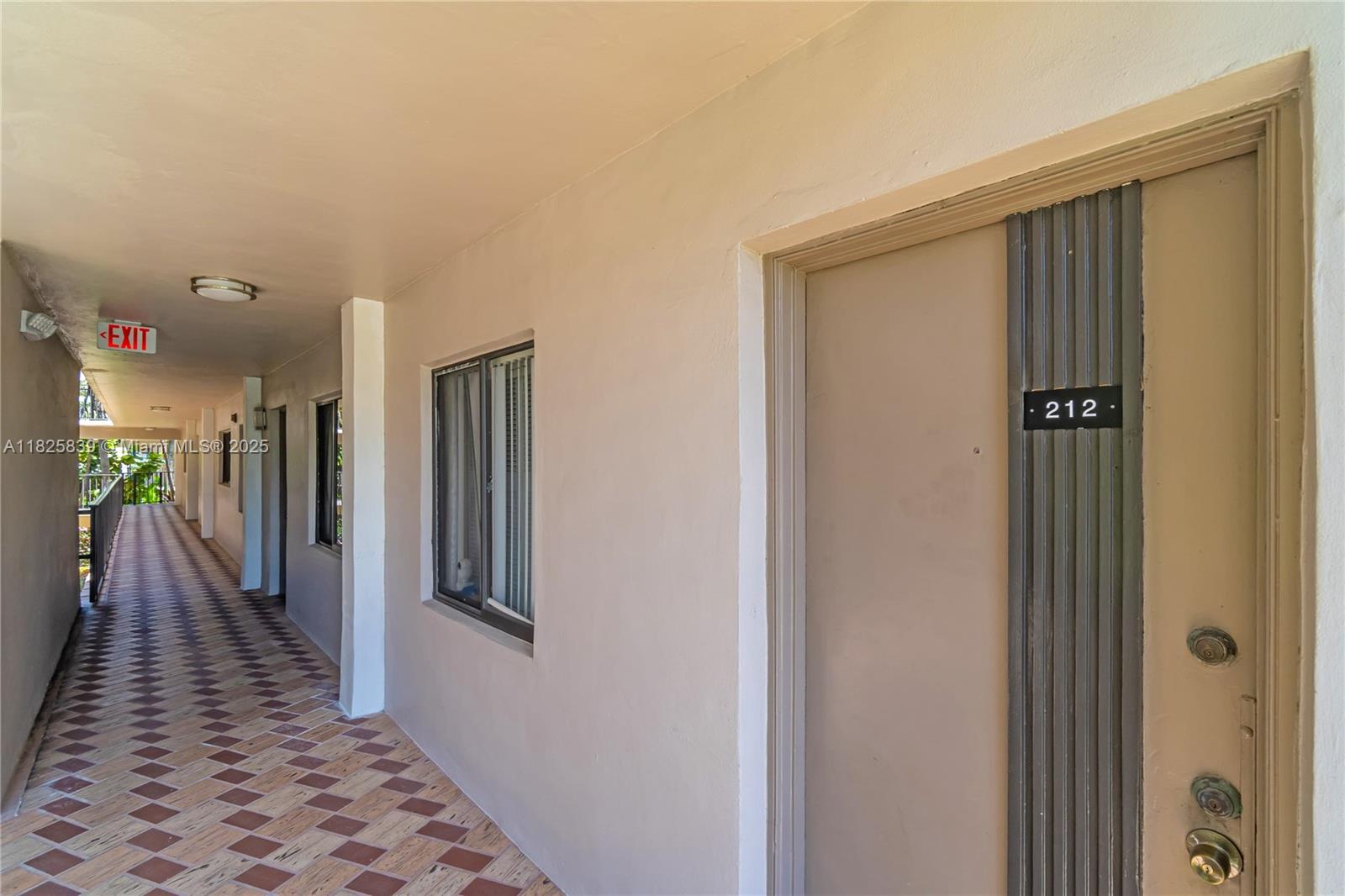 8400 Southwest 133rd Avenue Road, Unit 212 Miami, FL 33183 - Photo 3 of 32 a view of hallway with wooden floor