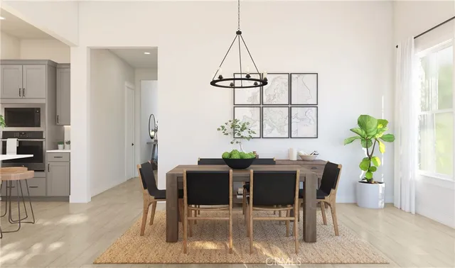 a view of a dining room with furniture and window