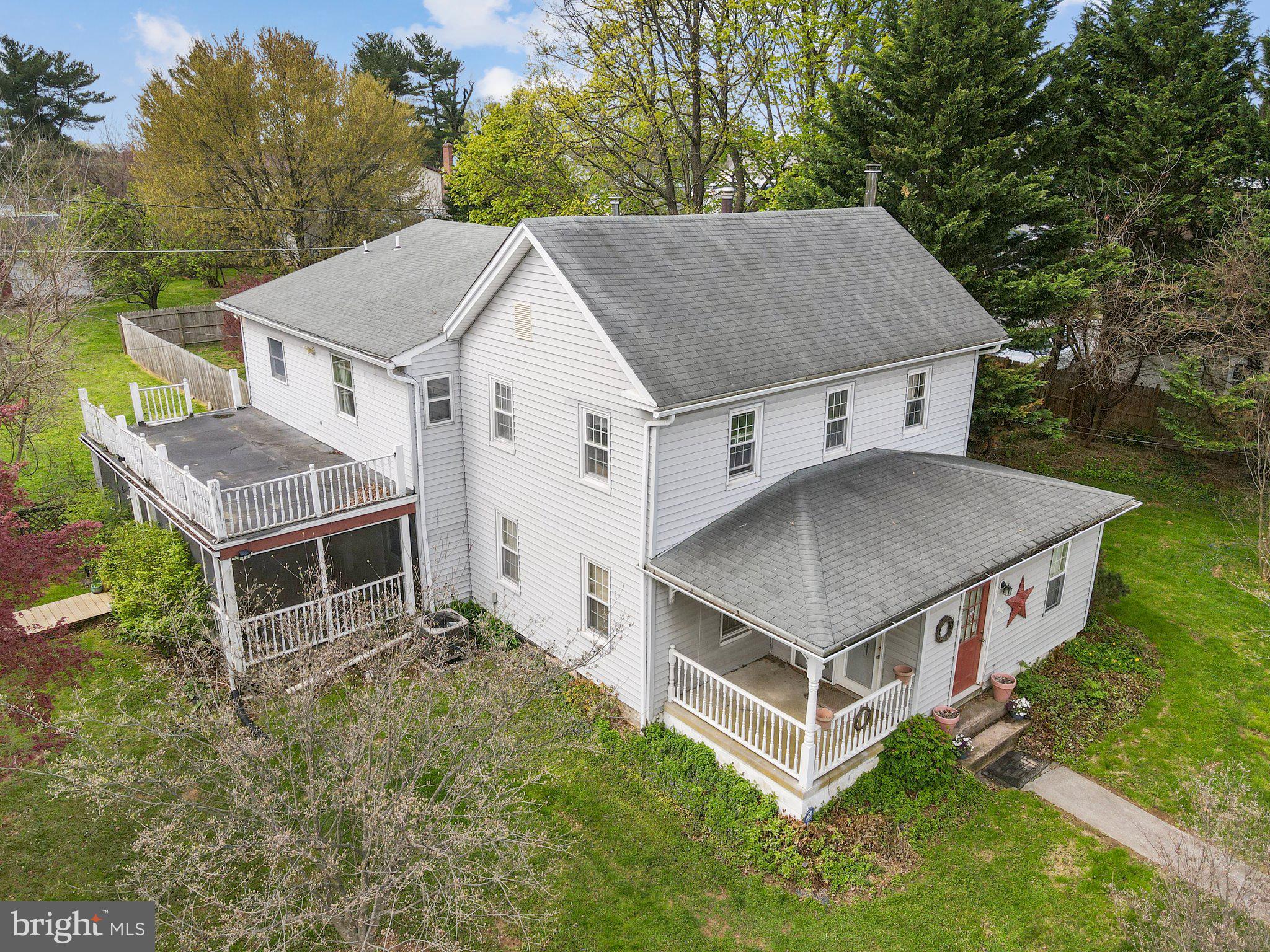 15921 Frederick Road Woodbine, MD 21797 - Photo 2 of 41 Charming home with lush greenery.