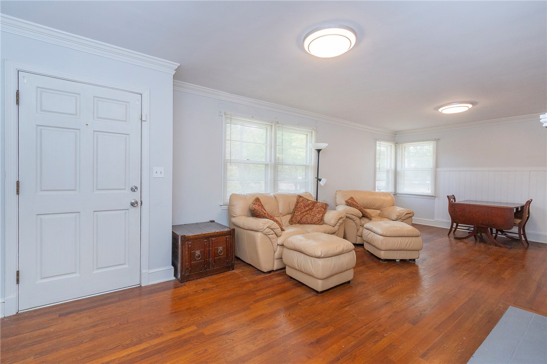 1218 Bolt Drive Anderson, SC 29621 - Photo 8 of 46 Hardwood flooring extends throughout this generous living area, offering a seamless flow and enduring appeal.