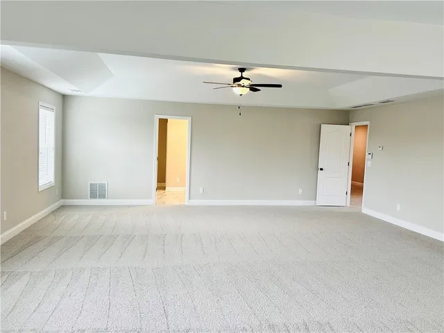 a view of empty room with windows
