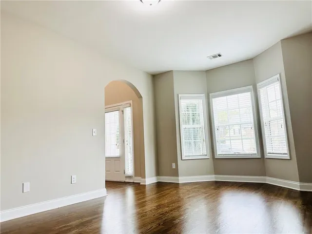 a view of a room with window and wooden floor