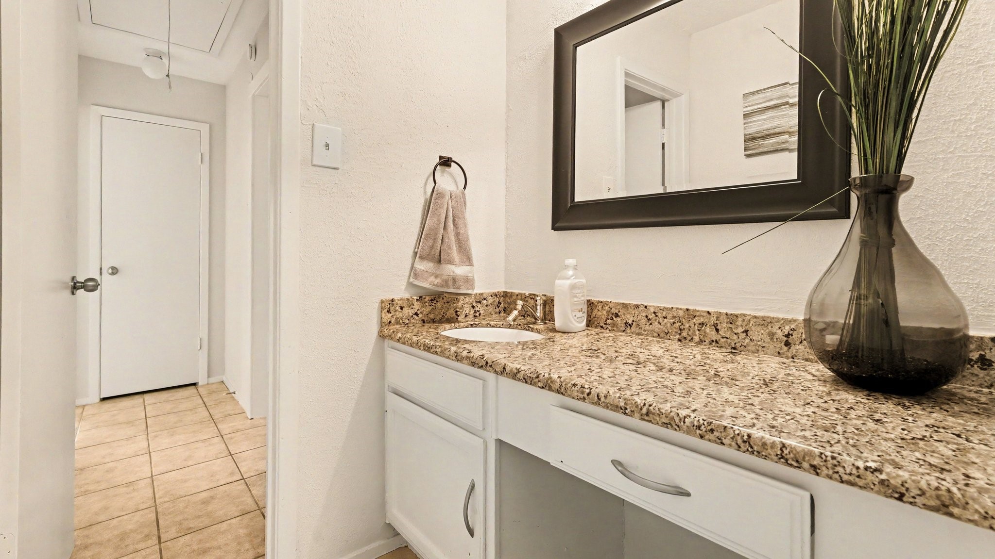 1506 Holbech Lane Channelview, TX 77530 - Photo 17 of 21 a bathroom with a sink and a mirror