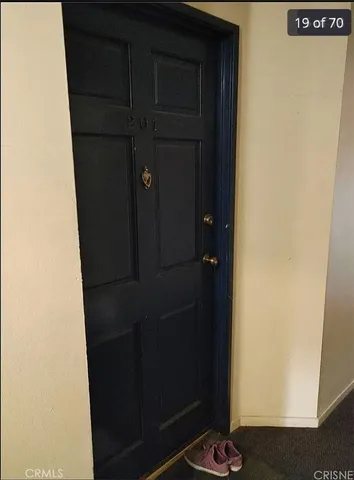 a kitchen with stainless steel appliances granite countertop a refrigerator sink stove and cabinets