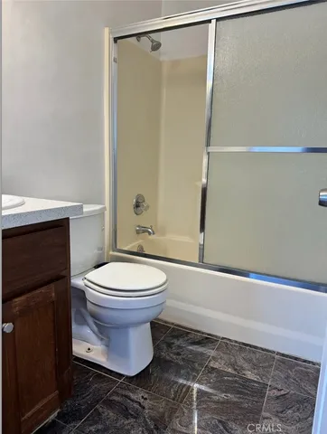 a view of wooden floor and windows in a room