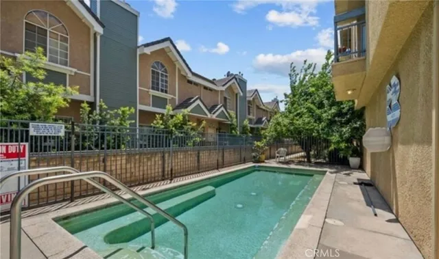 a view of balcony with wooden floor and outdoor seating