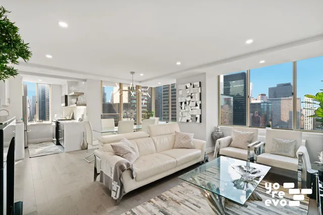a black and white photo of a living room