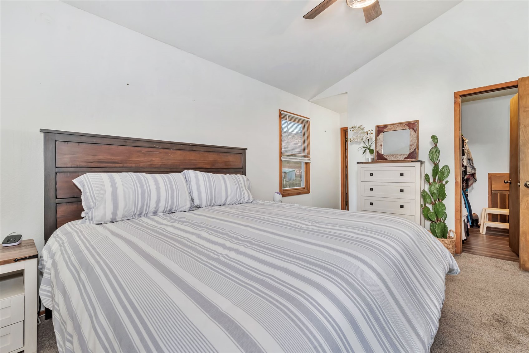 224 C R 206 Craig, CO 81625 - Photo 15 of 50 a bedroom with a bed and a chandelier