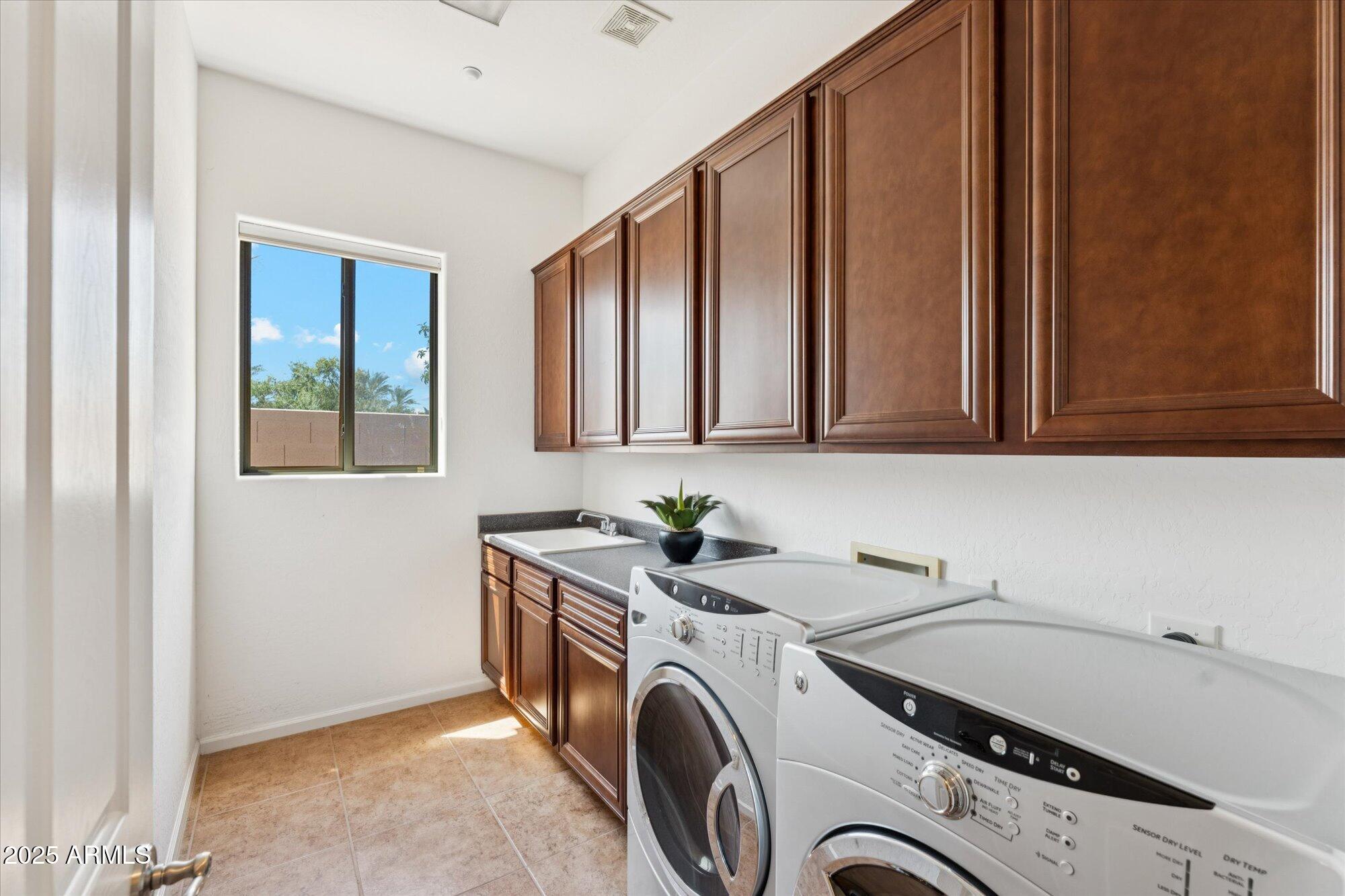 4959 North Village Road Litchfield Park, AZ 85340 - Photo 25 of 55 a utility room with dryer and washer