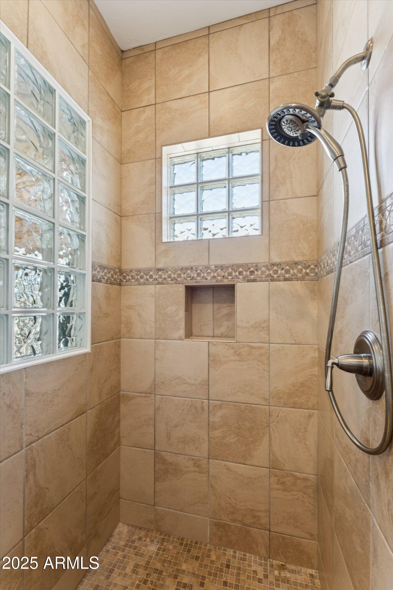 4959 North Village Road Litchfield Park, AZ 85340 - Photo 32 of 55 a bathroom with a shower