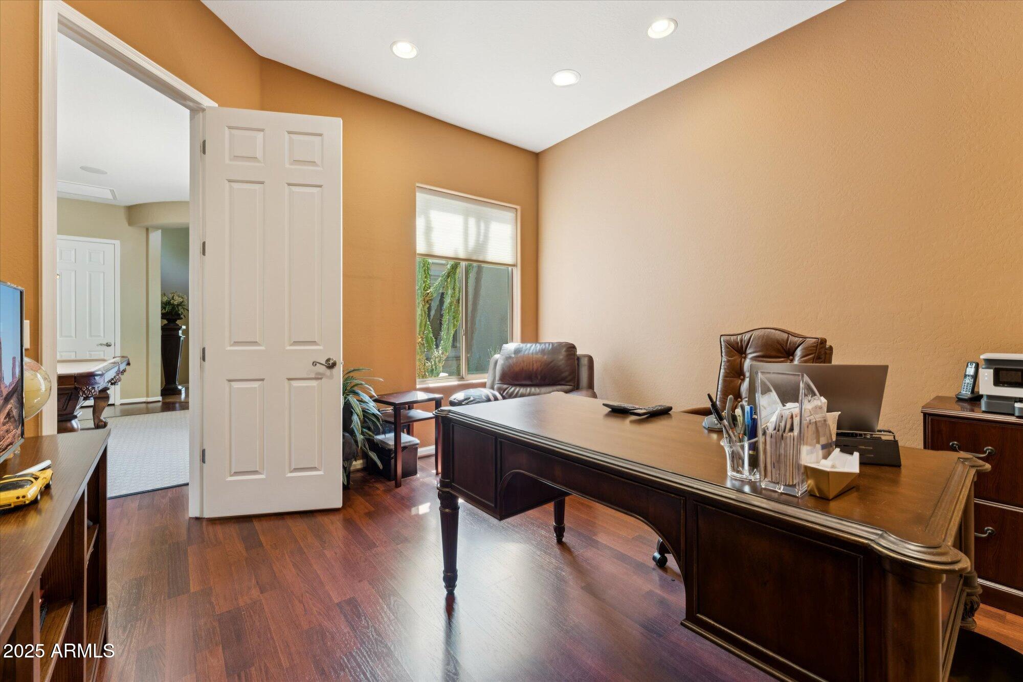4959 North Village Road Litchfield Park, AZ 85340 - Photo 39 of 55 a room with a wooden floor and furniture
