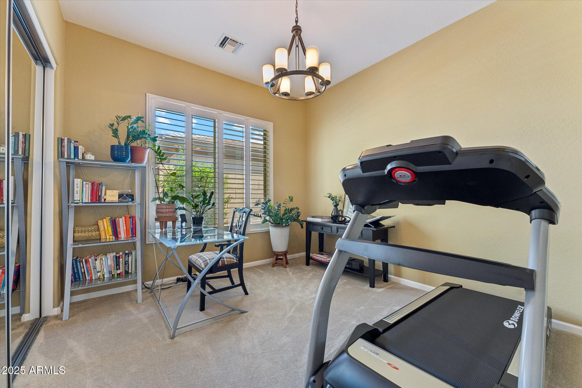 4959 North Village Road Litchfield Park, AZ 85340 - Photo 40 of 55 a room with furniture closet and a window