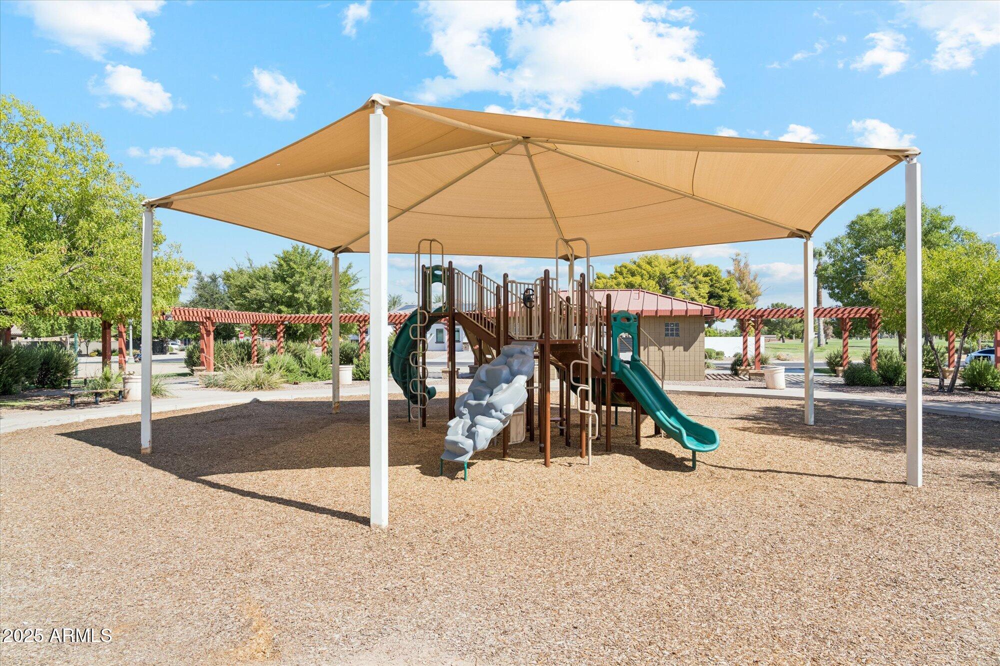 4959 North Village Road Litchfield Park, AZ 85340 - Photo 53 of 55 a view of a park with a slide and table