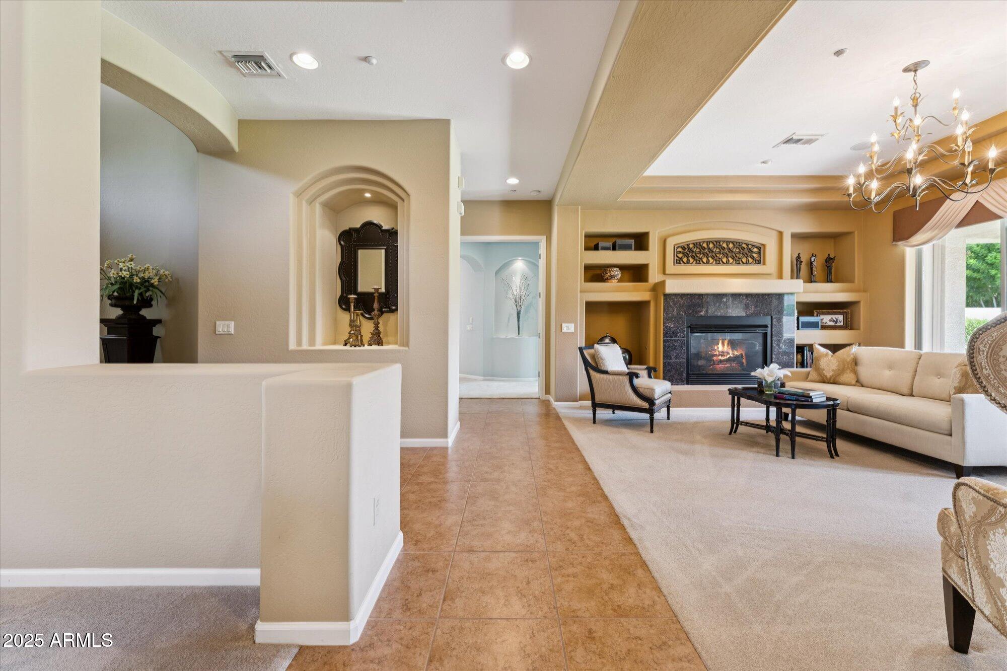 4959 North Village Road Litchfield Park, AZ 85340 - Photo 6 of 55 a living room with furniture and a fireplace