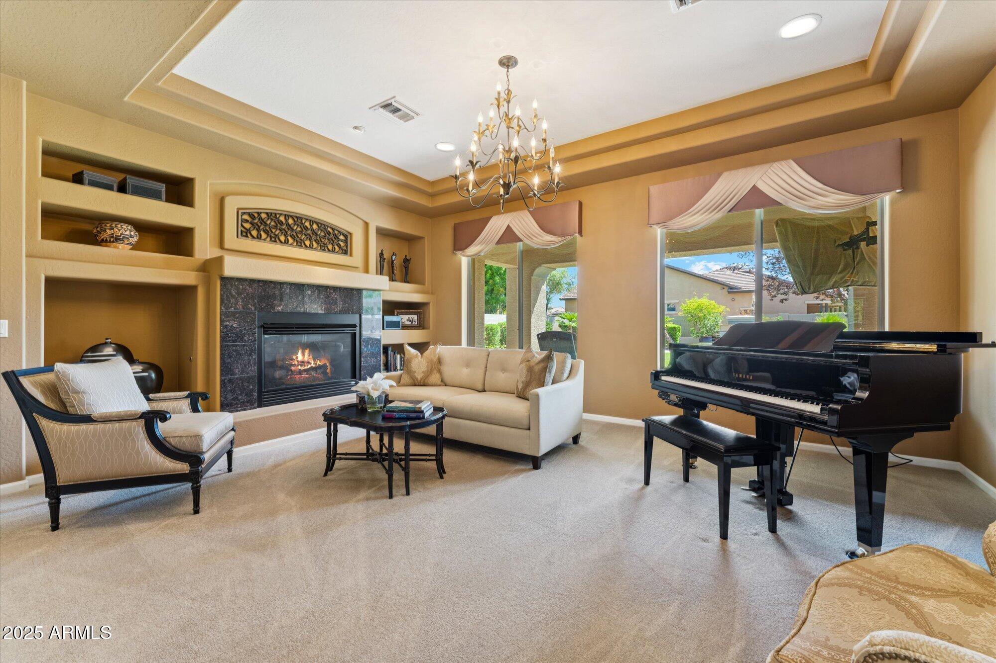 4959 North Village Road Litchfield Park, AZ 85340 - Photo 8 of 55 a living room with furniture and a fireplace