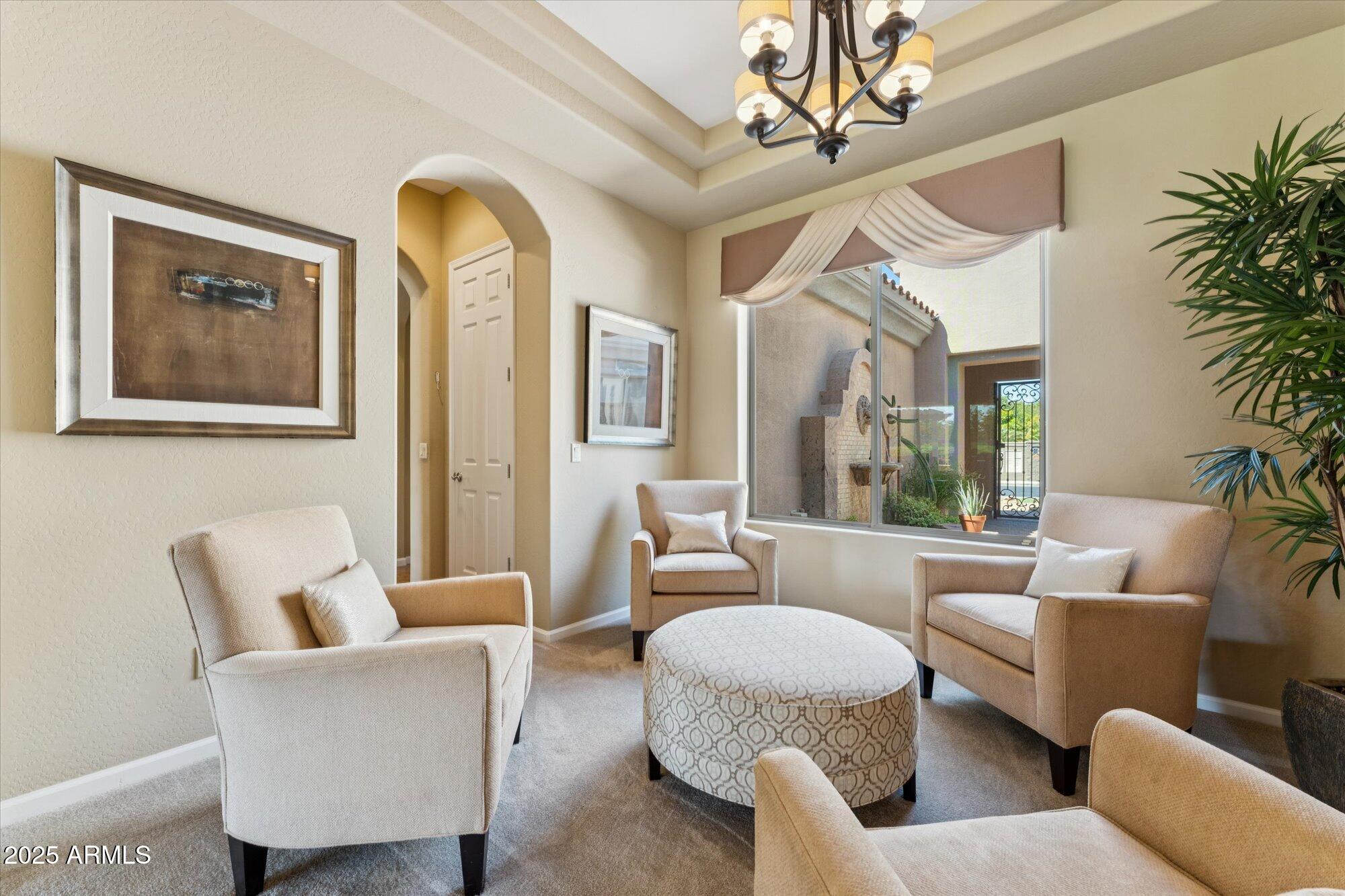 4959 North Village Road Litchfield Park, AZ 85340 - Photo 9 of 55 a living room with furniture and a large window