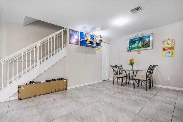 a view of a dining room with furniture
