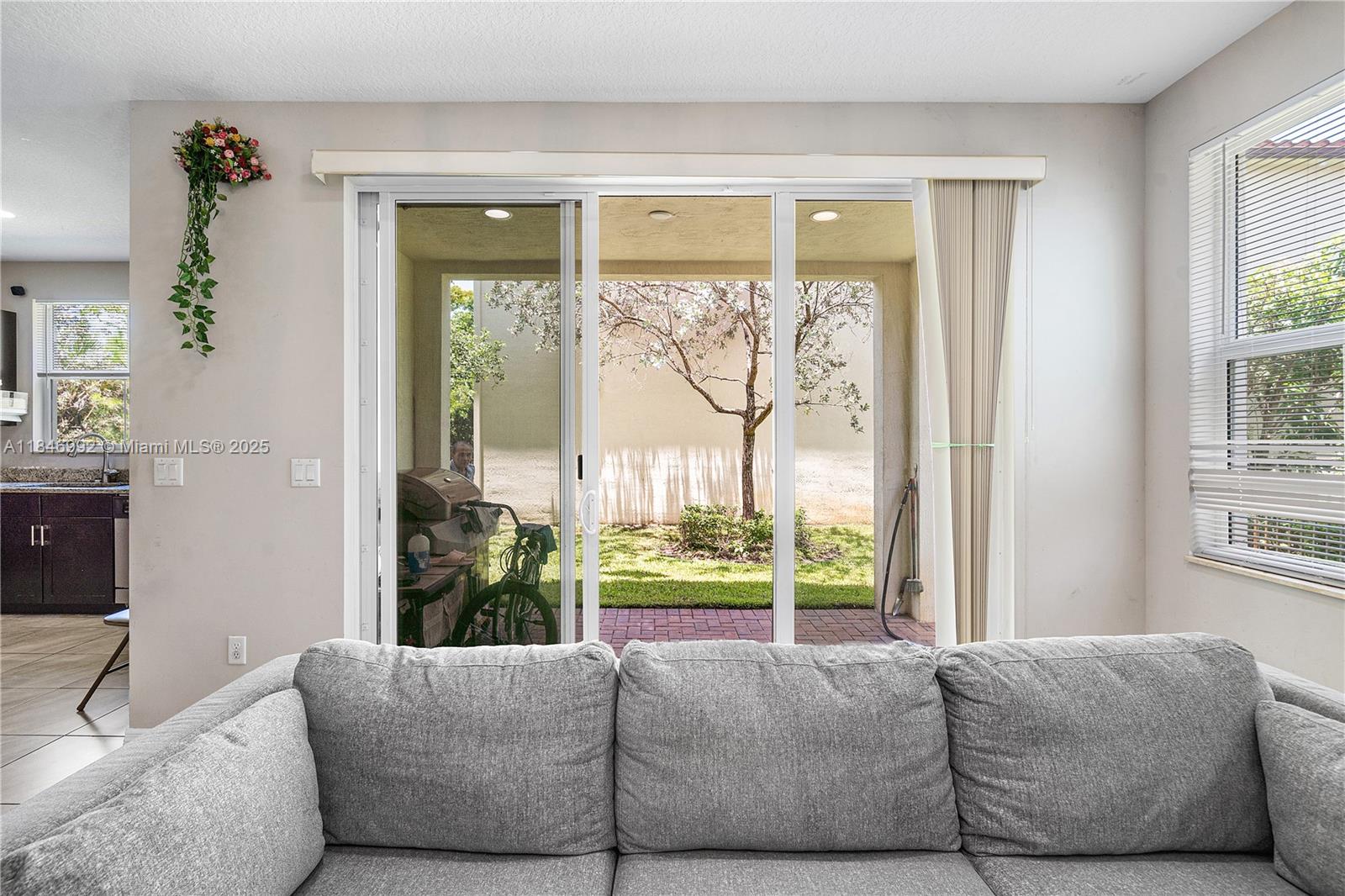 6411 Osprey Landing Street Davie, FL 33314 - Photo 20 of 38 a living room with furniture and a large window