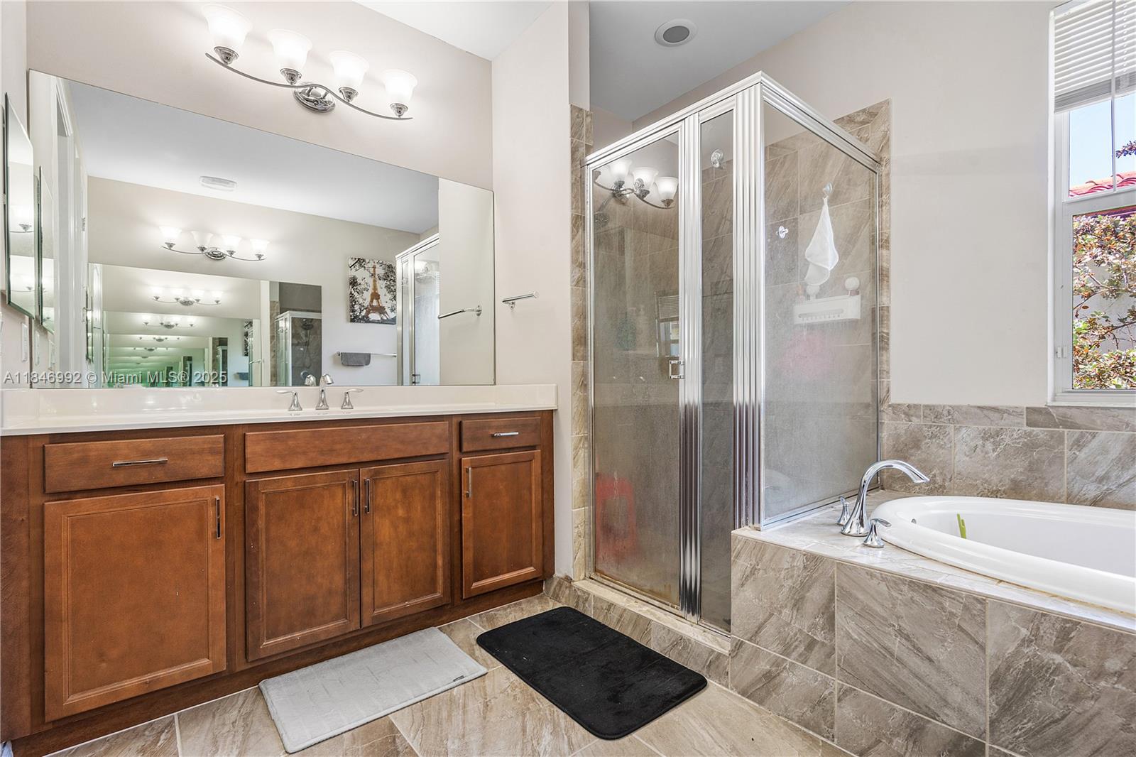 6411 Osprey Landing Street Davie, FL 33314 - Photo 26 of 38 a spacious bathroom with a tub shower and sink