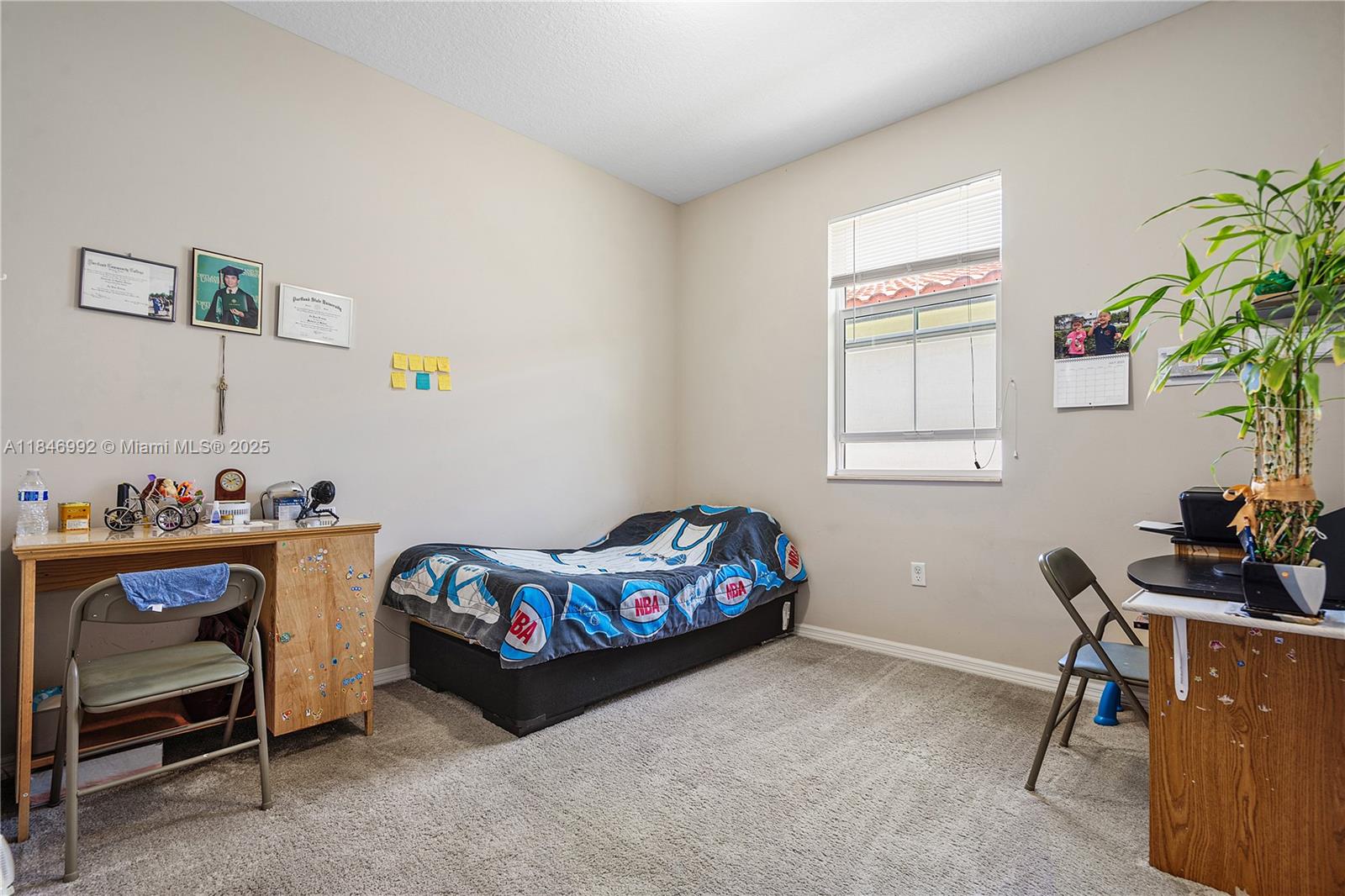 6411 Osprey Landing Street Davie, FL 33314 - Photo 28 of 38 a bedroom with furniture and a window