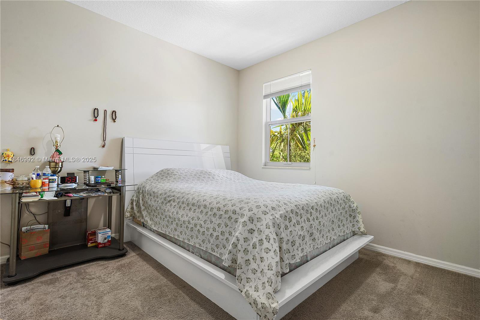 6411 Osprey Landing Street Davie, FL 33314 - Photo 32 of 38 a bedroom with a bed and a window