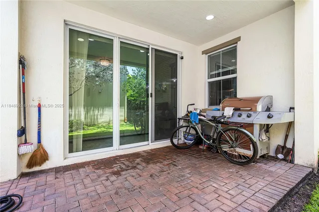 a view of an chairs and table in patio
