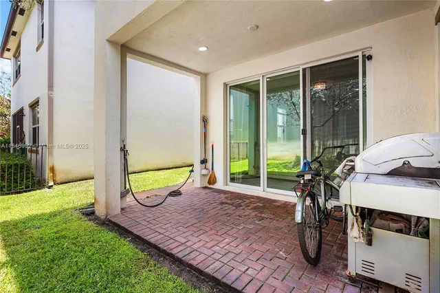 a view of backyard with tub and trees
