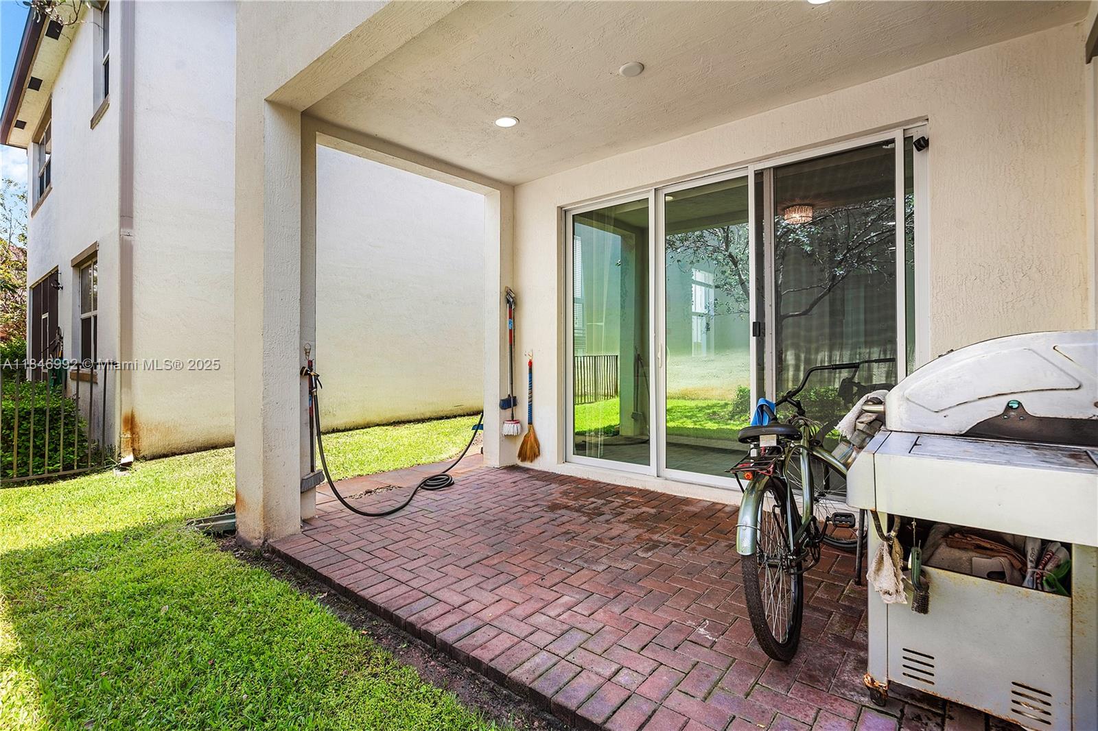 6411 Osprey Landing Street Davie, FL 33314 - Photo 34 of 38 a view of an chairs and table in patio