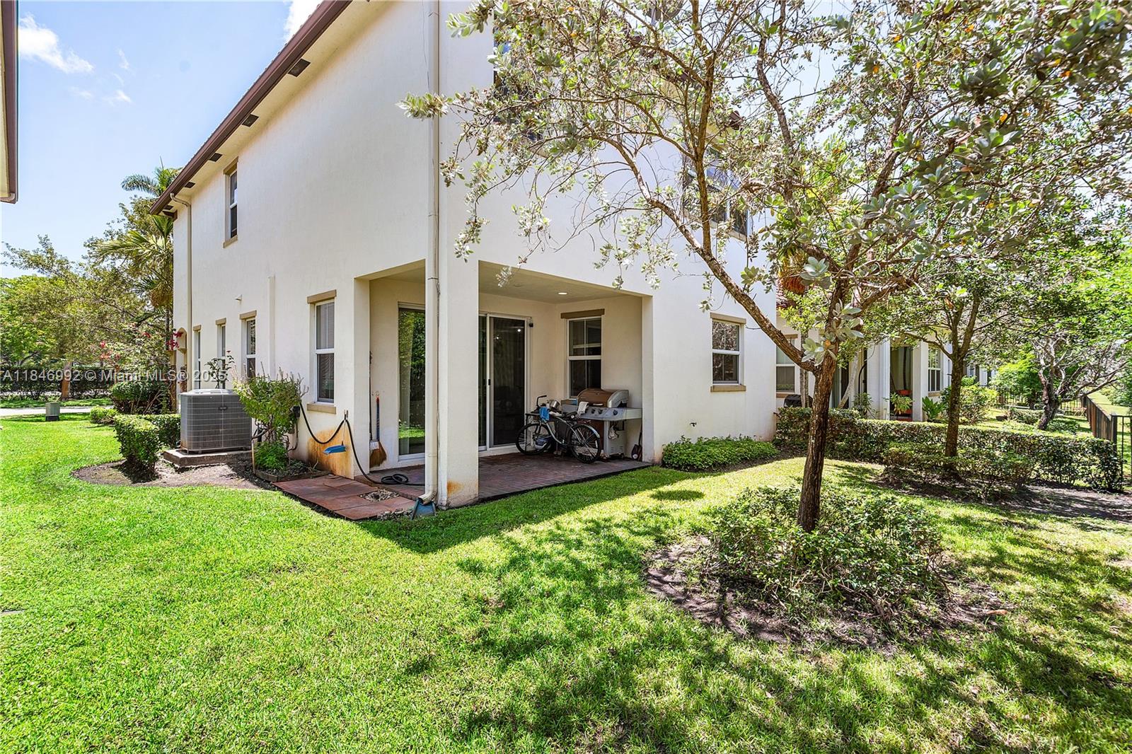 6411 Osprey Landing Street Davie, FL 33314 - Photo 37 of 38 a view of a house with backyard and a tree