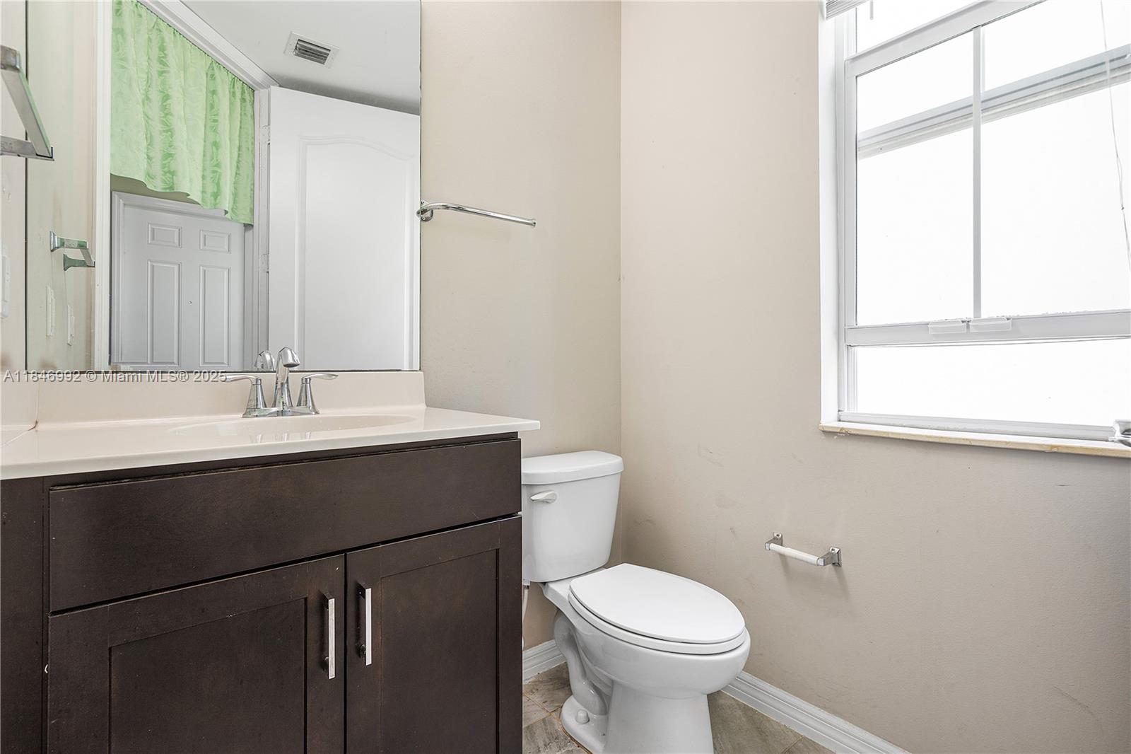 6411 Osprey Landing Street Davie, FL 33314 - Photo 5 of 38 a bathroom with a sink and a toilet