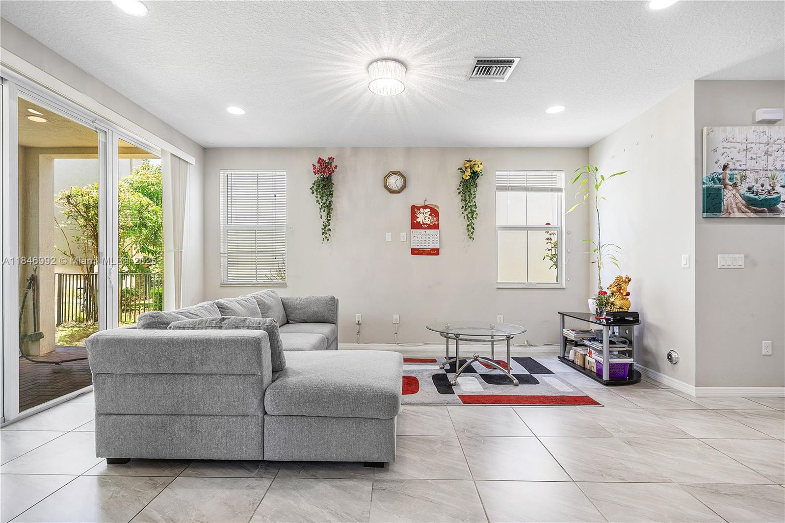 6411 Osprey Landing Street Davie, FL 33314 - Photo 7 of 38 a living room with furniture and a large window