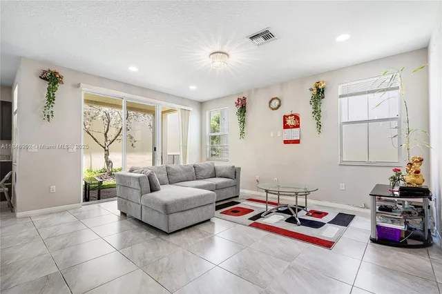 a living room with furniture and a table
