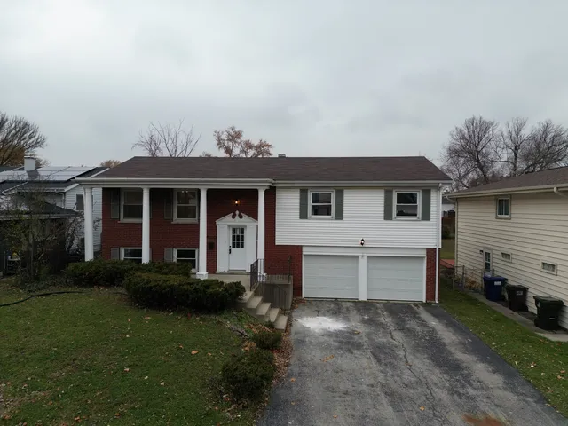 front view of a house with a yard