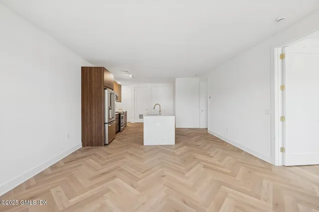 a view of a room with closet and windows