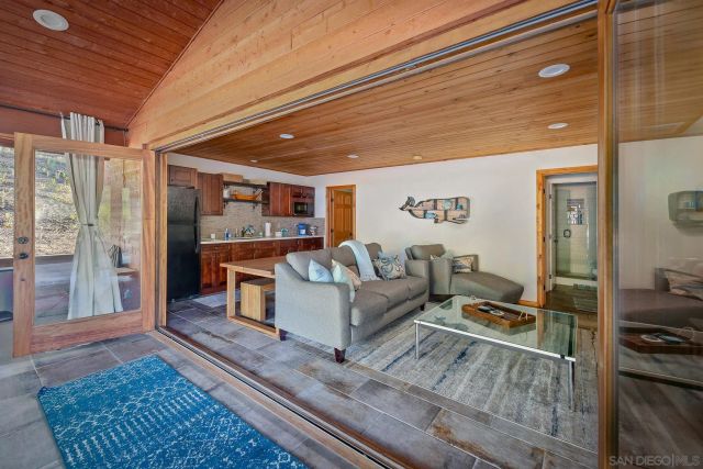 a living room with furniture and a rug