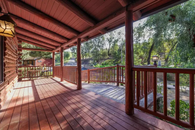 a view of porch with wooden floor