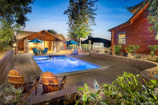 an aerial view of residential house and green space