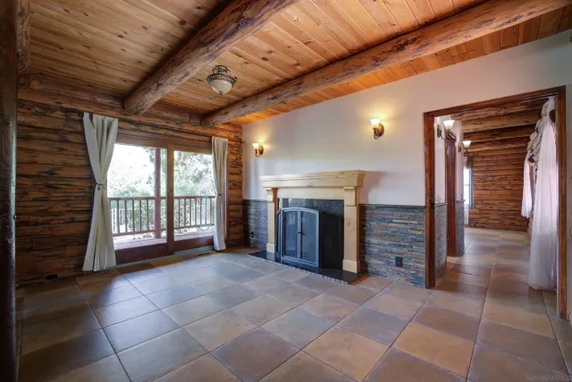 a view of an empty room with a fireplace