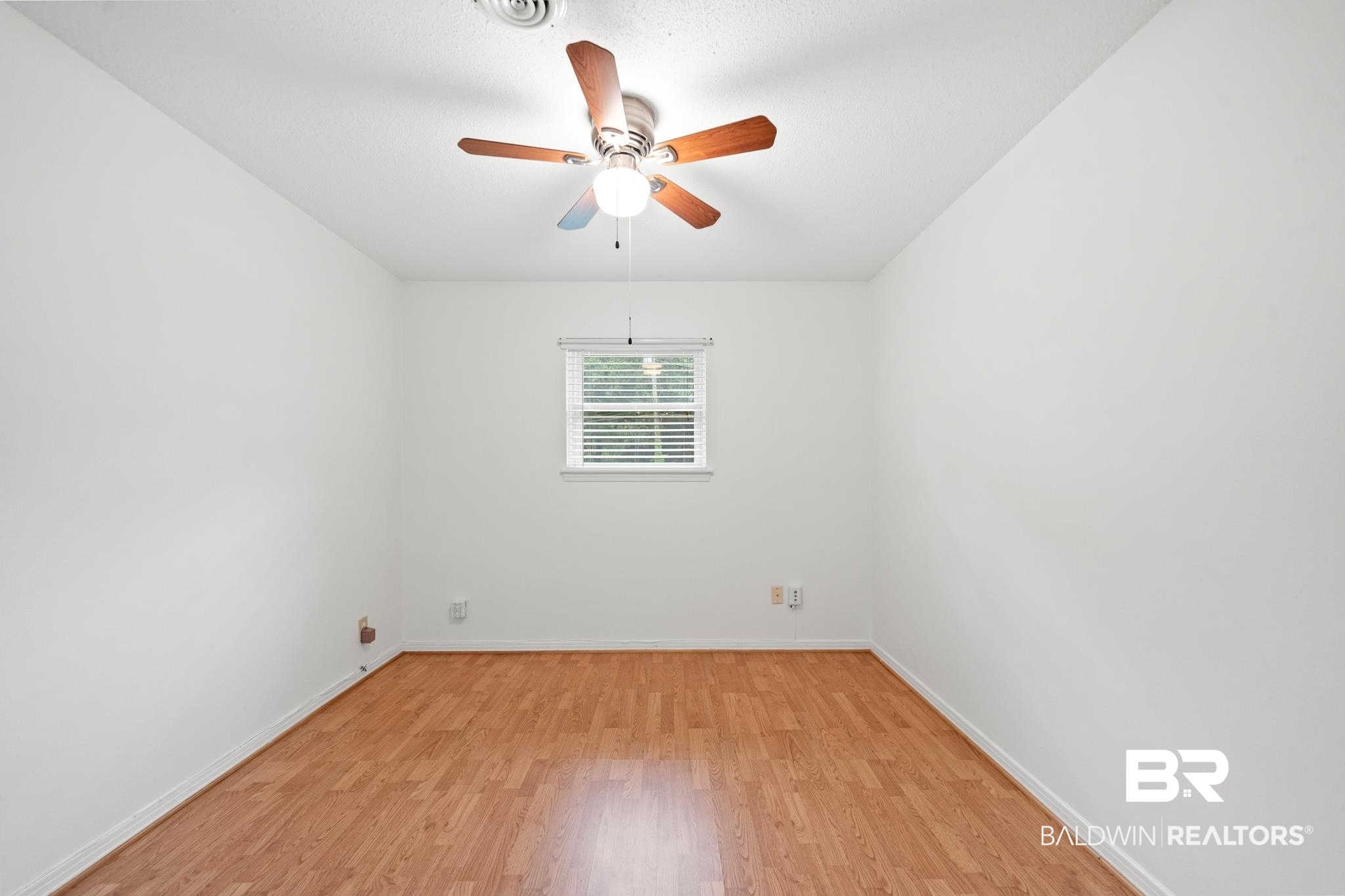 280 Thrift Street Mobile, AL 36609 - Photo 10 of 22 Empty room with ceiling fan and light wood-type flooring