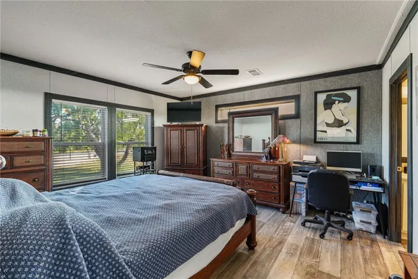 a bed room with a bed and a desk