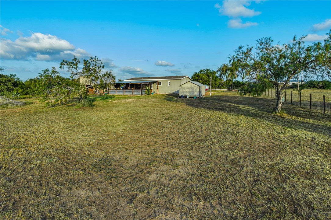 142 Meadow Trail Sandia, TX 78383 - Photo 27 of 40 a backyard of a house with lots of green space