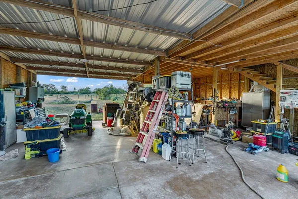 a view of a backyard with large trees