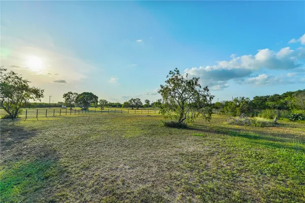 a view of a golf course with a lake