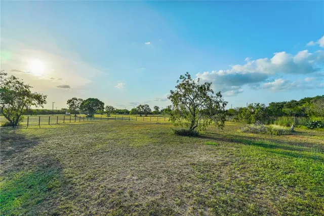 a view of a golf course with a lake