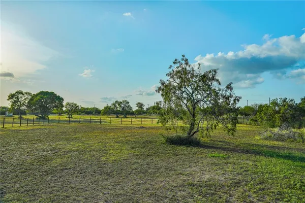 a aerial view of a house with a yard