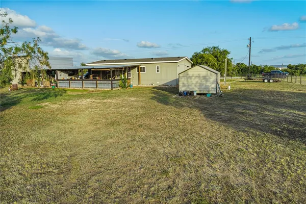 a backyard of a house with lots of green space