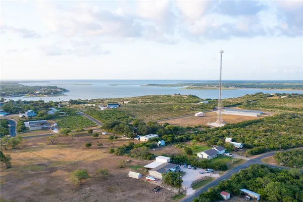 a view of a lake with houses in the back