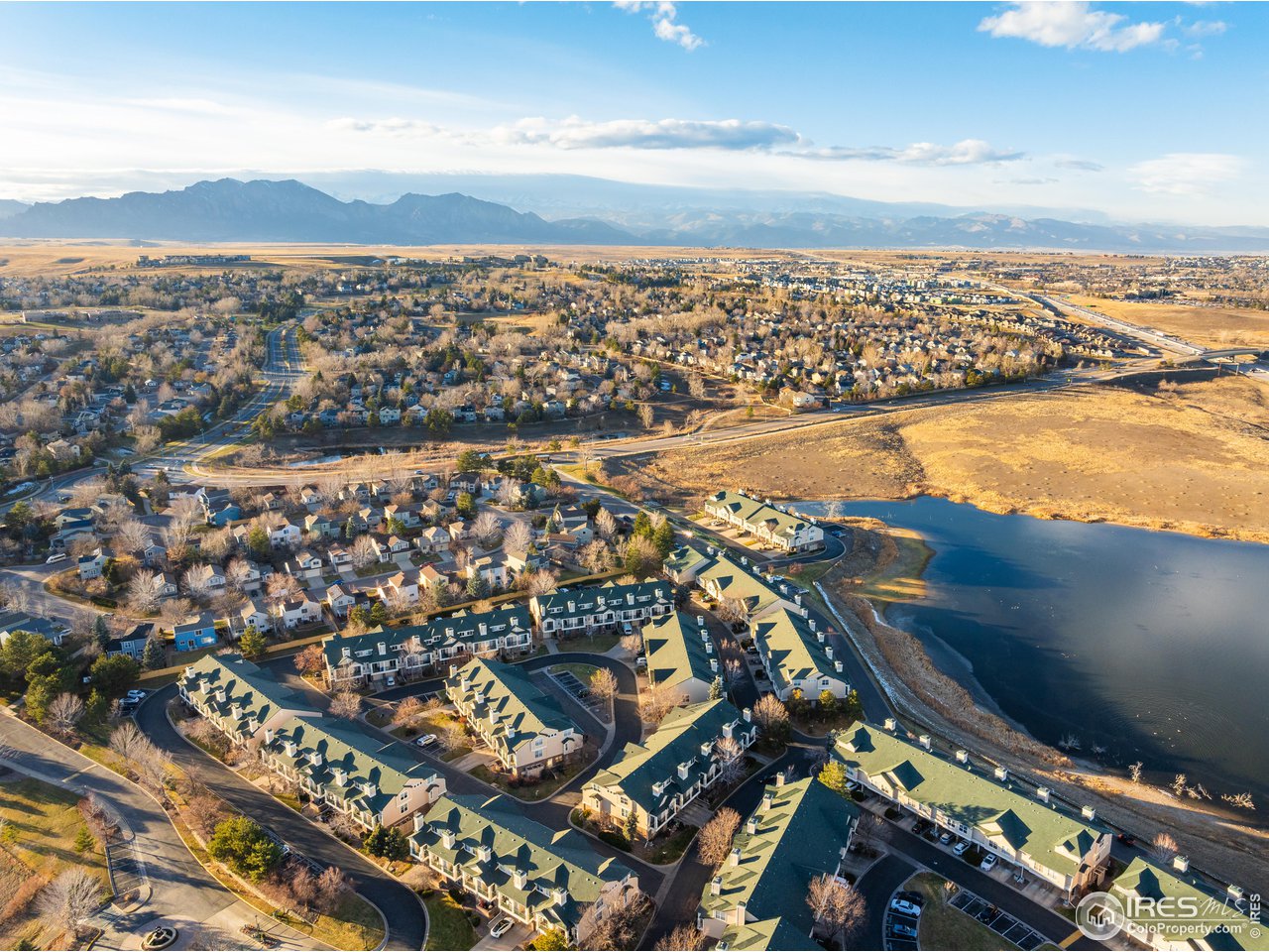 an aerial view of residential building and ocean