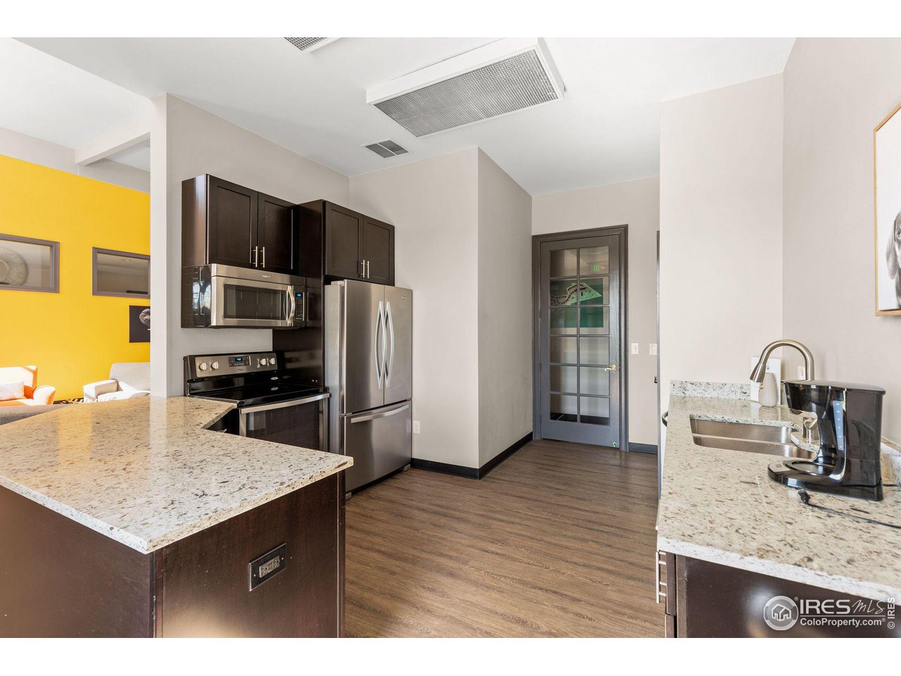 1855 Spaulding Circle Superior, CO 80027 - Photo 22 of 32 a kitchen with stainless steel appliances granite countertop a sink a stove and refrigerator