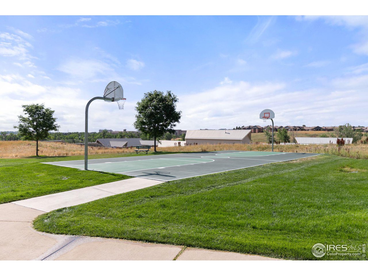1855 Spaulding Circle Superior, CO 80027 - Photo 30 of 32 a park view with multi story residential apartment building in the back